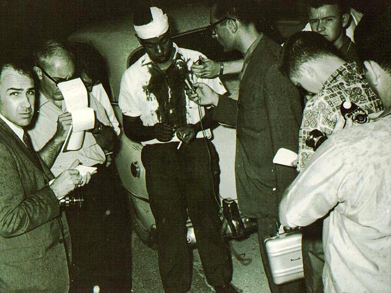 An injured C.B. King talks to reporters after being caned by Dougherty County sheriff Cull Campbell in the sheriff’s office