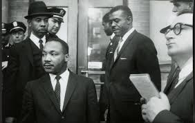 C.B. King (wearing hat) working with Martin Luther King Jr.