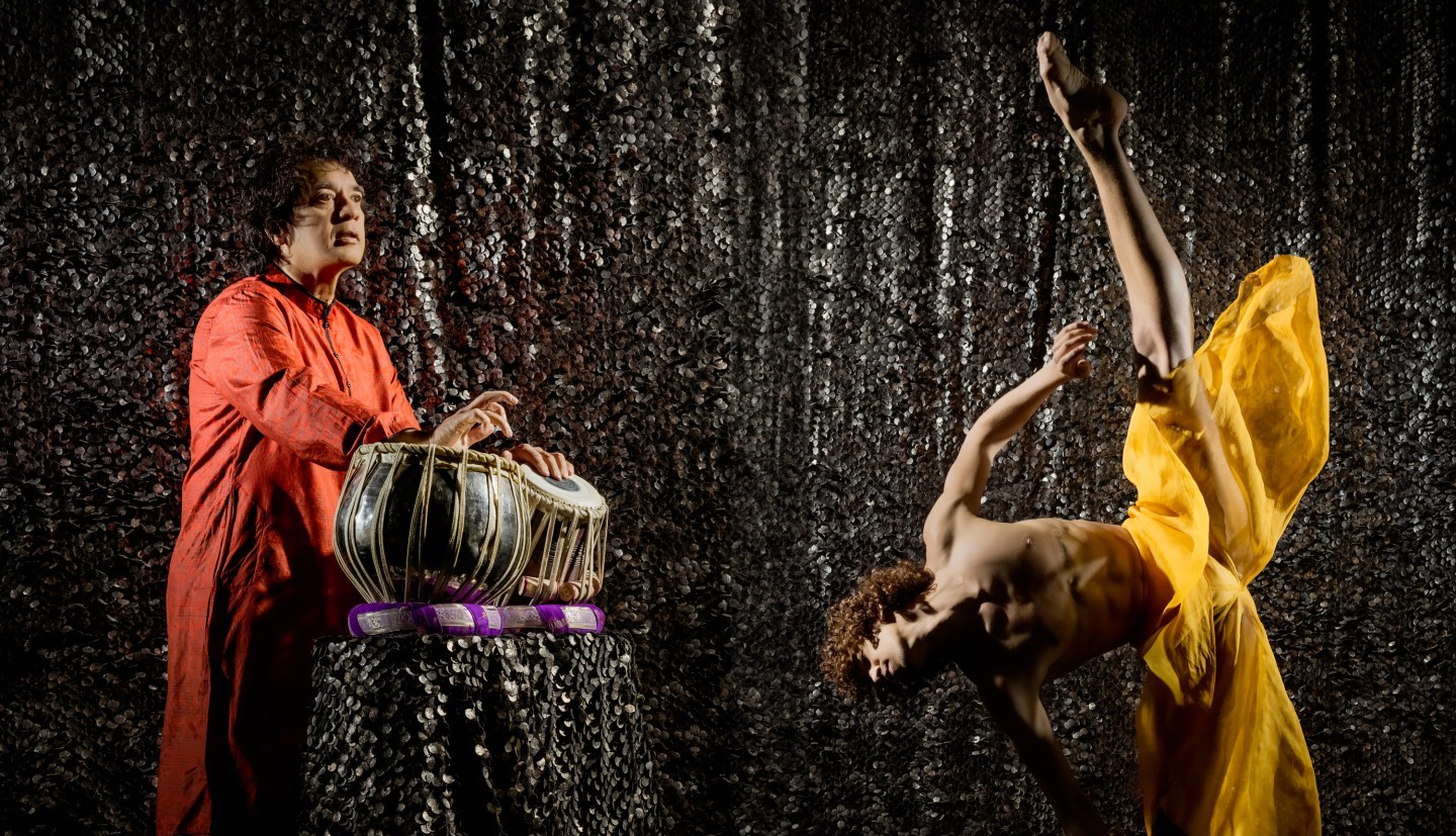 Zakir Hussain playing tabla as LINES Ballet company artist Shuaib Elhassan dances