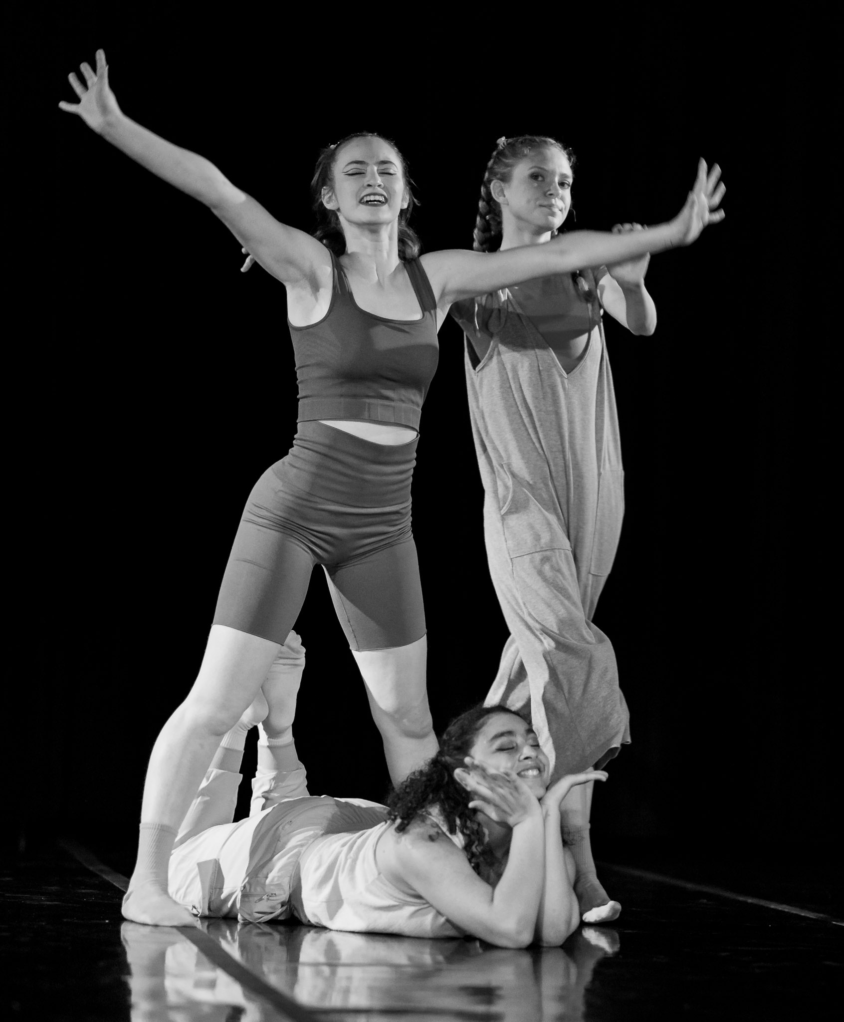 Amanda Harris, Brooke “Frank” Sinton, and Rowan Williams performing on stage at Dominican University of California (image is in black and white)
