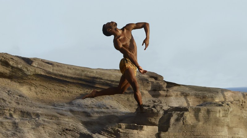 LINES Ballet Company dancer Josh Francique dancing on a cliffside before the sky