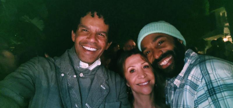 LINES Ballet Board Member Aaron Walton (far left), American actress and comedian Cheri Oteri (center), and LINES Ballet Company Dancer Babatunji (far right) after the LINES Ballet performance of "Deep River" in Beverly Hills, standing together and smiling outdoors at night