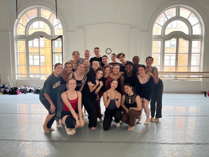 LINES Ballet Summer Program student Gabriel Warren gathered with other LINES’ Advanced Summer Program students; they are smiling together in a studio at LINES Dance Center