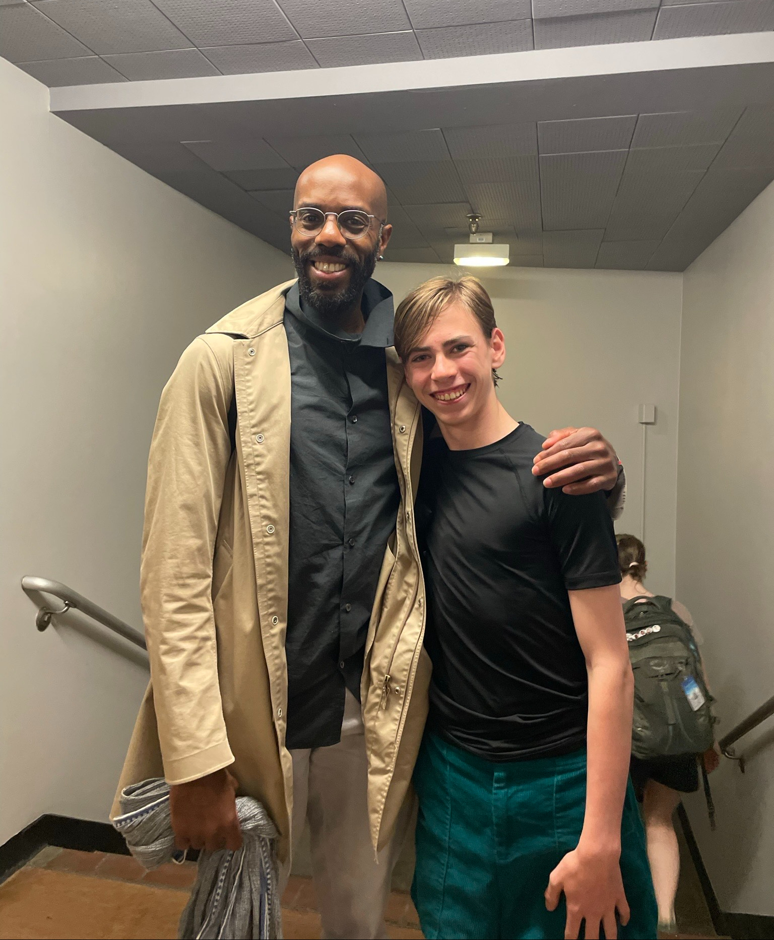 LINES Ballet Summer Program student Gabriel Warren with LINES Ballet Summer Program choreographer (and former LINES Ballet dancer) Keelan Whitmore; both are smilng, and Keelan is holding a scarf