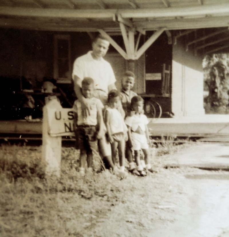 Peggy King Jorde’s dad (C.B. King) with Peggy and three of her brothers, (L to R) Leland, Peggy, Clennon, and Kenyon. Together, they're on a family outing at the local train station in Albany, Georgia in the 1960s.